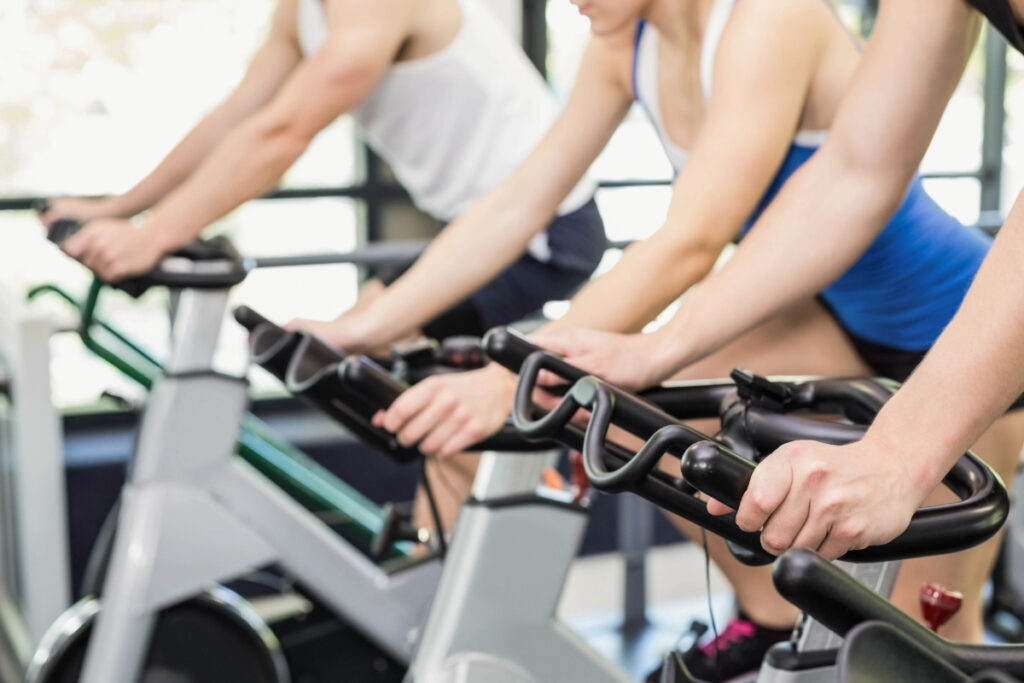 Fit Group of People on Stationary Bikes