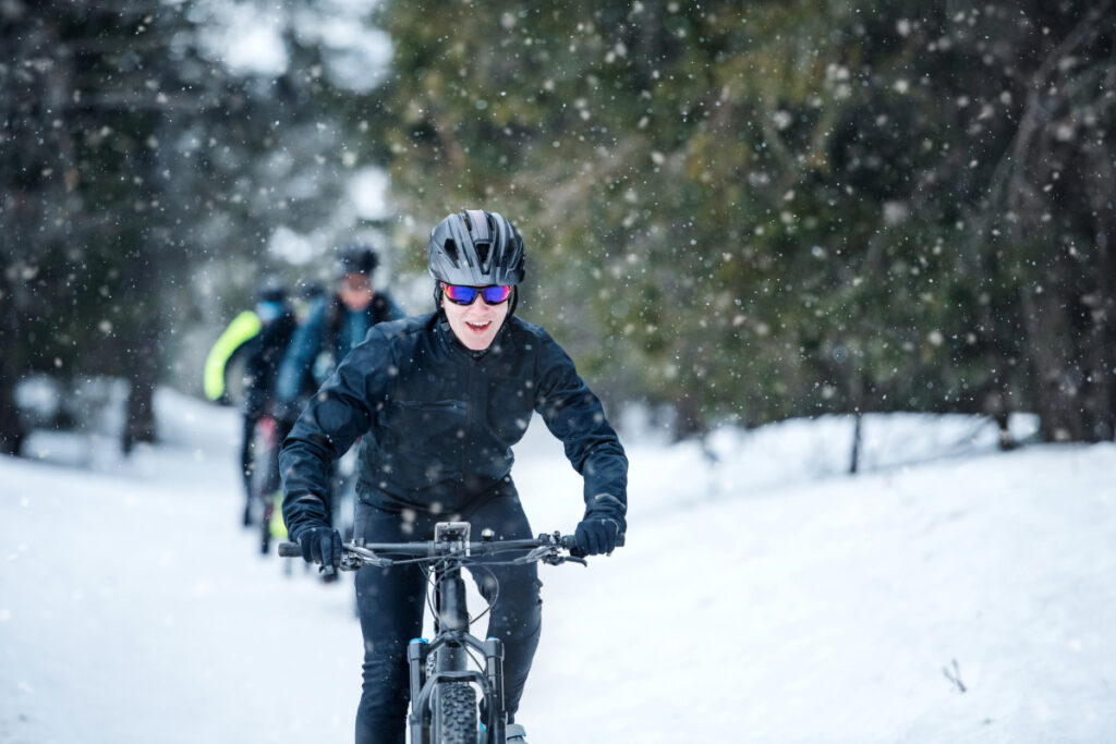 Male Cyclist Riding Bike During Winter