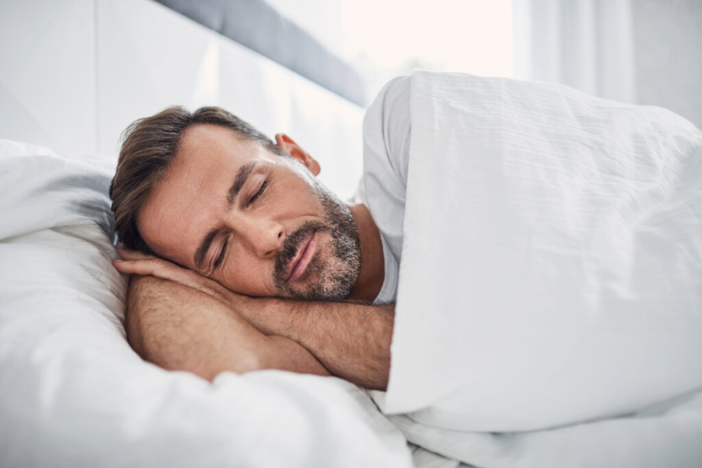 Man Sleeping in Bed recovering from concussion