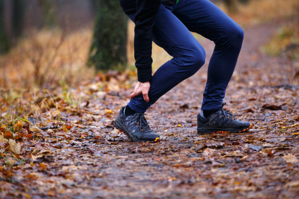 Person suffering from trail running injury