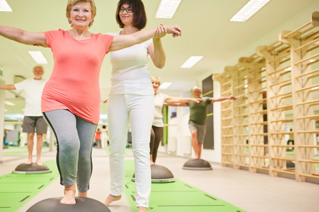 Trainer gives senior help with Balance training