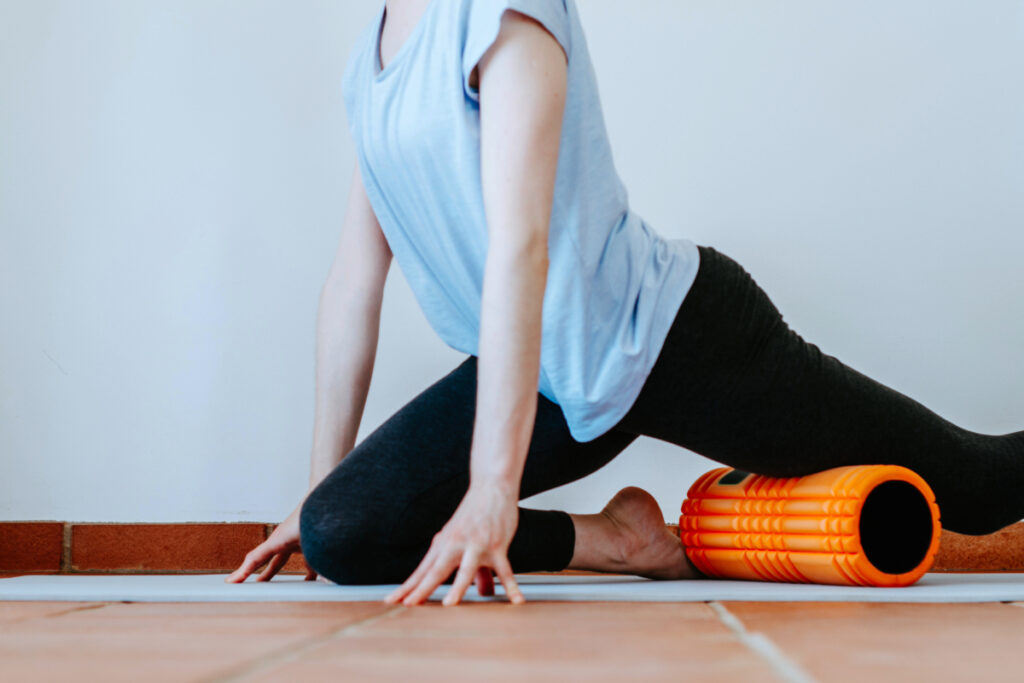 Woman doing foam roller stretches