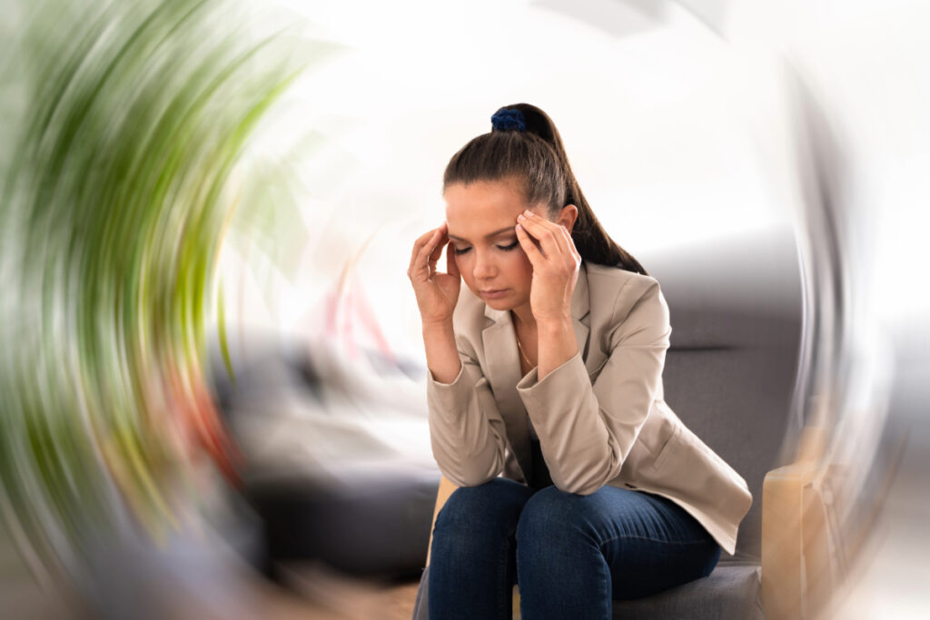 Woman Suffering from Vertigo Dizziness