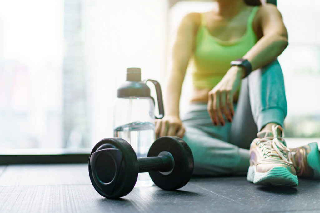 Woman training with dumbells